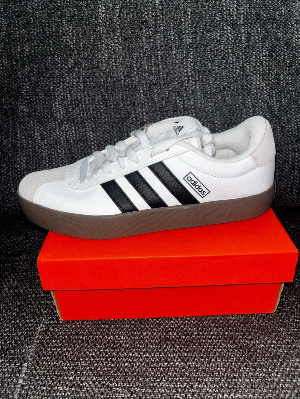 Adidas unisex White Sneaker with Black Stripes